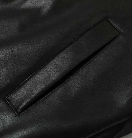 Close-up of the stylish pocket detail on the Faux Fur Hooded Jacket – Street Style, showcasing its modern design.