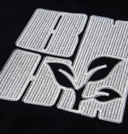 Cross Embroidered Hoodie – Loose Fit featuring symbolic cross embroidery design on a black sweatshirt.