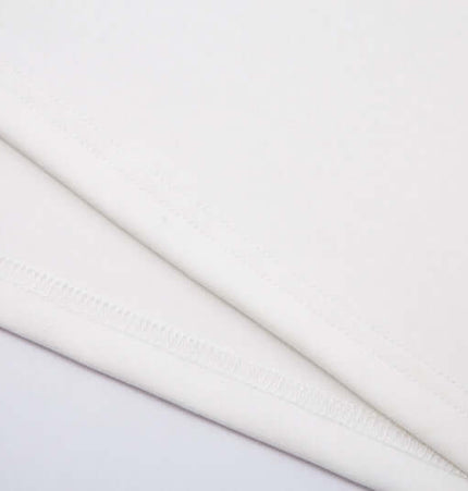 Close-up of fabric construction showcasing the soft texture of the Retro Embroidered Patchwork Polo Hoodie.