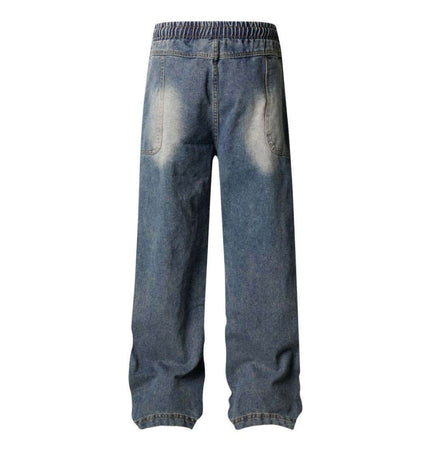 Distressed Pleated Reverse Denim Pants showing the back view with a washed finish and relaxed fit.