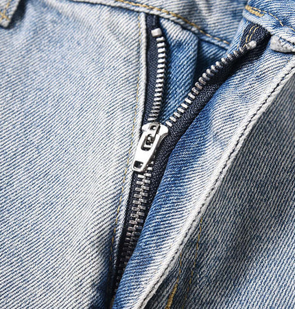 Close-up of the zipper detail on Washed Micro Flared Jeans – Loose Fit, showcasing high-quality denim craftsmanship.