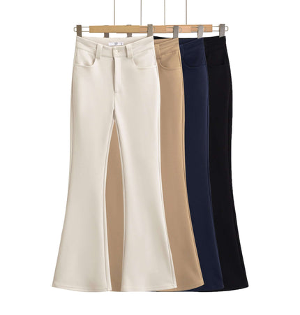 High Elastic Micro Flare Casual Pants in white, beige, navy, and black hanging on wooden hangers.