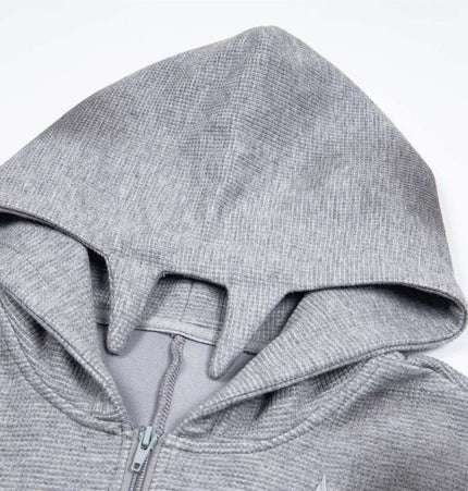 Distressed Letter Zip Hoodie - Loose Fit hood detail featuring gray fabric and embroidered letter design.