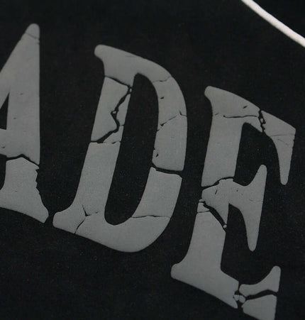 Close-up of the printed design on the Faux Suede Printed Hoodie – Loose Fit, showcasing its bold vintage style.