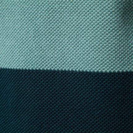 Close-up of fabric texture showcasing the color-blocked design of the Stand Collar Half-Zip Knit Sweater.
