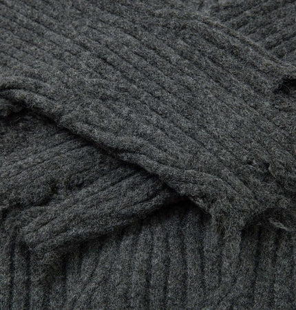 Close-up of the textured fabric of the Ripped Hem Knit Cardigan – Loose Fit showcasing the distressed hem.