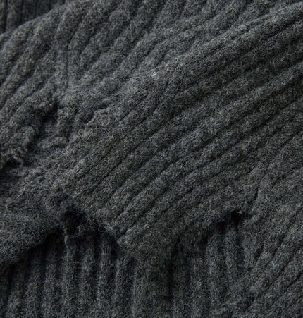 Close-up of the fabric detail of the Ripped Hem Knit Cardigan – Loose Fit showcasing the distressed ripped hem design.