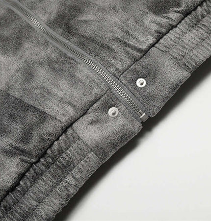 Close-up of the zipper detail on the Hooded Fur Collar Jacket – Loose Fit in gray fabric.