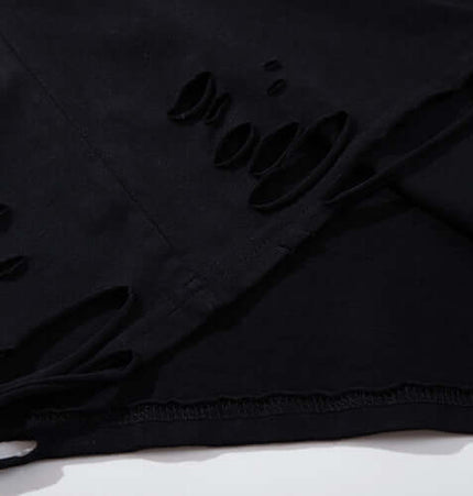 Close-up of the distressed fabric on the Butterfly Print TShirt – Loose Fit showcasing unique tear details.