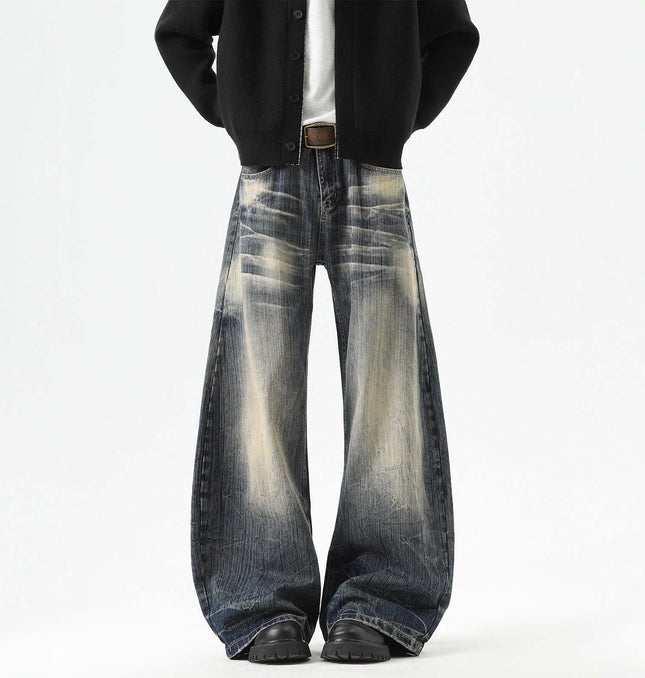 Knife-Edge Denim Trousers – Loose Fit showcasing knife-edged seam detailing with a washed distressed finish.