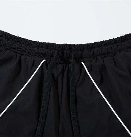 Tape Decorated Casual Wide-Leg Pants close-up view of waistband and contrast stripe detailing.