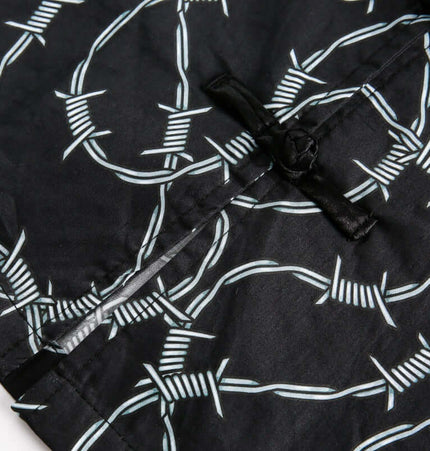 Striped Short Sleeve Shirt - Loose Fit fabric detail with barbed wire pattern on black background.