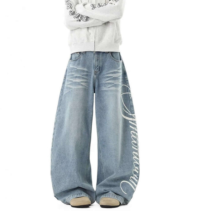 Washed Letter Print Jeans - Loose Fit showcasing a unique wide-leg silhouette and retro distressed detailing in light denim.