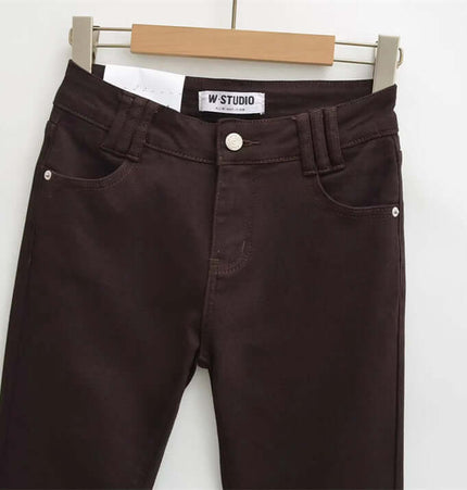 Retro Low Waist Flared Denim Pants close-up showing button closure and pocket details.