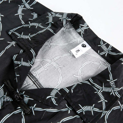 Striped Short Sleeve Shirt - Loose Fit collar and inner label close-up showcasing bold stripe patterns