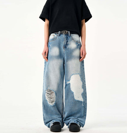 Casual Ripped Light Blue Jeans – Loose Fit worn by a model showcasing stylish ripped detailing.