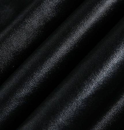 Black faux leather fabric showcasing texture for the Oversized Reversible Hooded Parka.