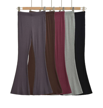 Slim Fit Low Waist Slightly Flared Pants collection displayed in various colors on hangers.