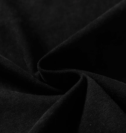 Close-up of the soft black fabric used in the Washed Spliced Distressed TShirt – Loose Fit.