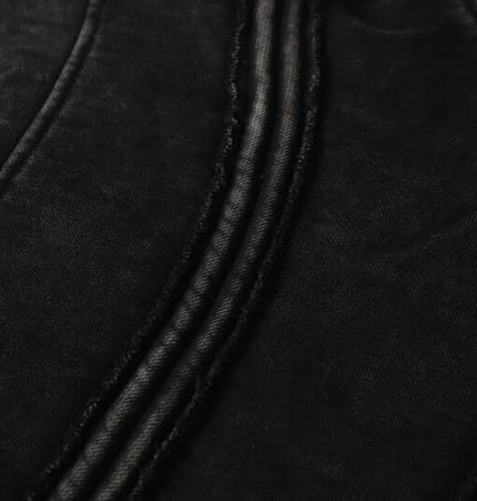 Close-up of the fabric texture featuring stitching details of the Stripe Patchwork Hoodie – Loose Fit.