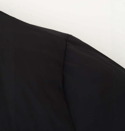 Close-up of the fabric detail on the Grozavu Stand Collar Zip Jacket – Casual Fit, showcasing its sleek black design.
