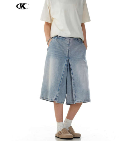 Washed Blue Denim Shorts – Loose Fit on a model, showcasing relaxed summer styling and vintage-inspired look.