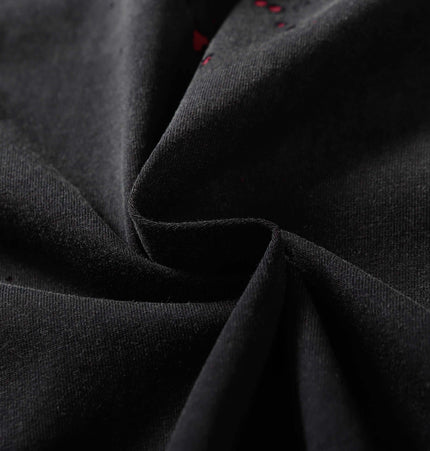 Close-up of fabric showcasing the texture of the Retro Splatter Print TShirt – Loose Fit, highlighting its breathable cotton material.