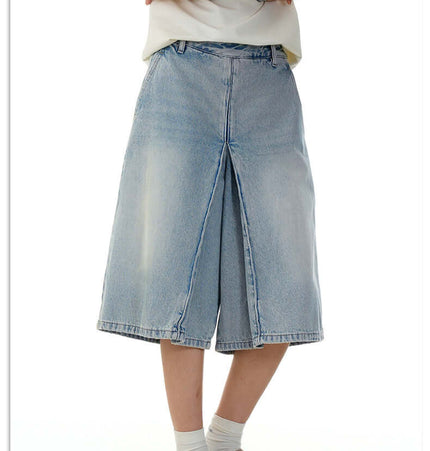 Washed Blue Denim Shorts – Loose Fit worn by a person showcasing vintage-inspired summer style.