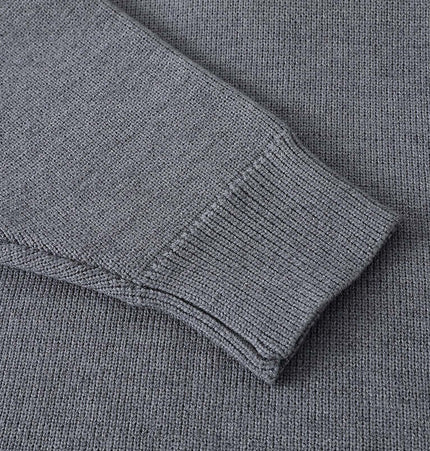 Close-up of the sleeve detailing of the Casual Ribbed Half-Zip Sweater in gray, showcasing ribbed texture.