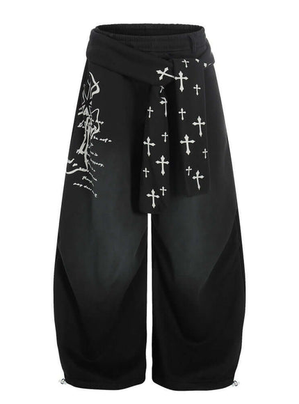 Model wearing Black graffiti cross dirty curved sweatpants by Grozavu