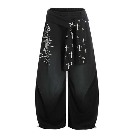 Model wearing Black graffiti cross dirty curved sweatpants by Grozavu