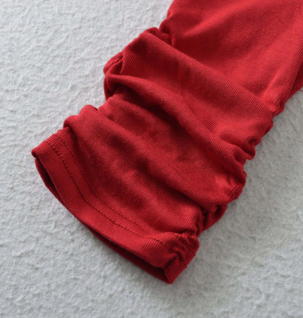 Detail of the sleeve of the SculptFit High-Neck Long Sleeve Top showcasing the soft texture and stylish design.