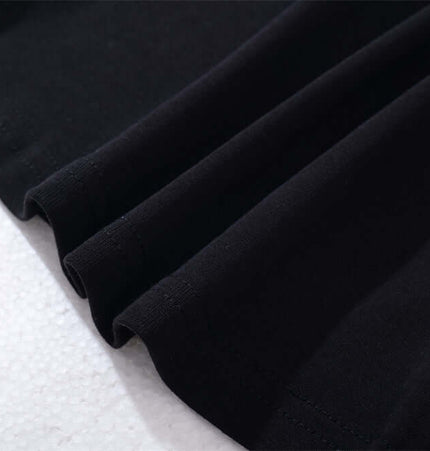 Close-up of the fabric detail of the Long Sleeve Printed TShirt - Slim Fit in black.