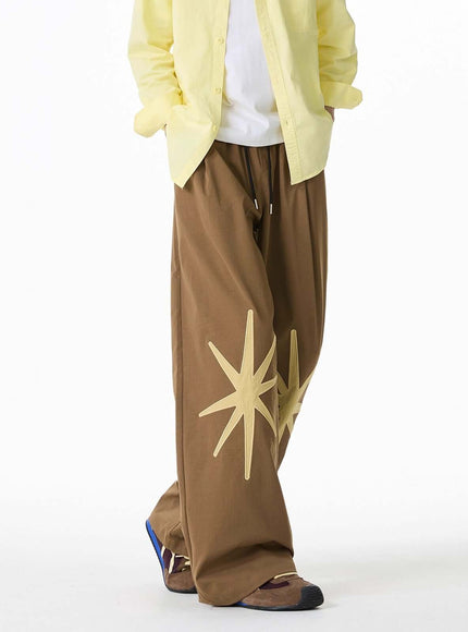 Back view of Black patterned technical trousers by Grozavu