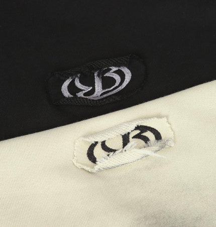 Creative Vintage Hoodie – Loose Fit label details on black and cream fabric blend