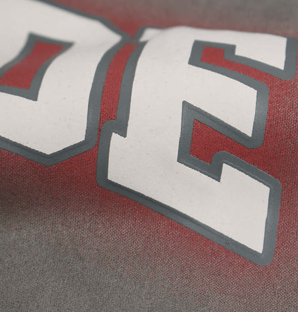 Close-up of the bold print design on the Faux Suede Print Zip-Up Hoodie – Loose Fit.