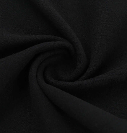 Soft black fabric swirled, showcasing the material of the Lace Patchwork VNeck Top – Slim Fit.