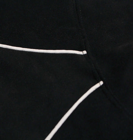 Close-up of the seam details on a Faux Suede Printed Hoodie – Loose Fit, highlighting the structured design.