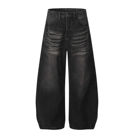 Washed Black Vintage Knife Cut Jeans featuring cat whisker fade and relaxed fit for street style.
