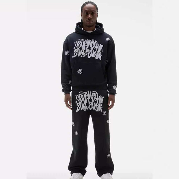 Printed Top and Long Pants – Street Fit worn by model, featuring bold urban design and relaxed fit.