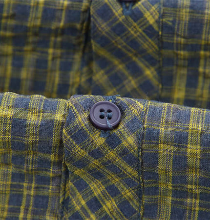 Casual Plaid Shirt – Relaxed Fit close-up of the fabric and button detail showcasing the plaid pattern.
