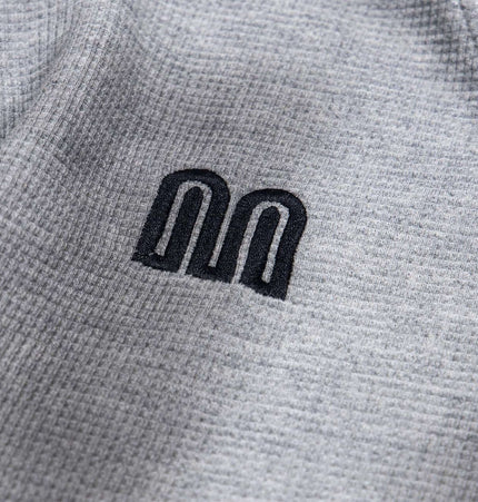 Distressed Letter Zip Hoodie - Loose Fit featuring embroidered letter detail on gray fabric.