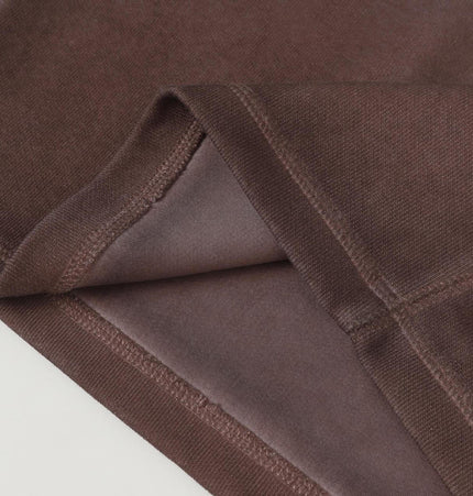 Close-up of the fabric texture of the Old Patchwork Hoodie – Loose Fit showing quality stitching and design details.