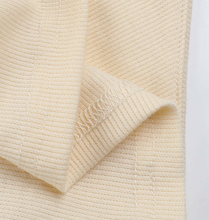 Close-up of smooth fabric showcasing the soft texture of the Split Neck Suspender Top – Slim Fit.