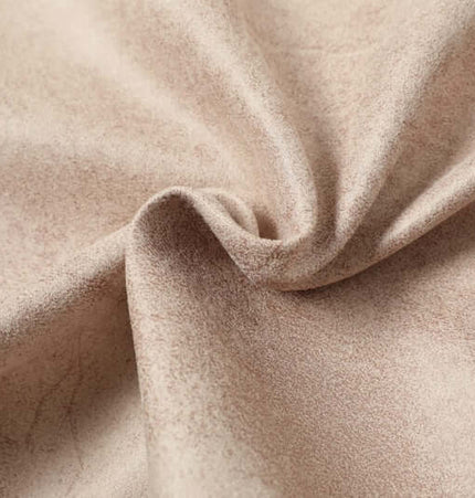 Close-up of soft beige fabric, showcasing texture used in the Faux Fur Hooded Jacket – Street Style.