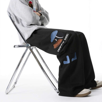 Embroidered Dog Sweatpants – Loose Fit featuring playful dog embroidery and relaxed streetwear style.