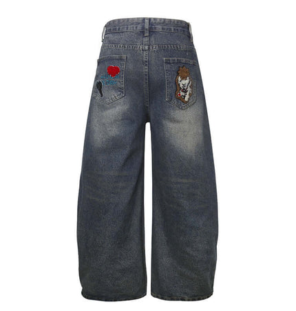 Vintage Washed Cartoon Embroidered Jeans showcasing playful towel embroidery on back pockets.