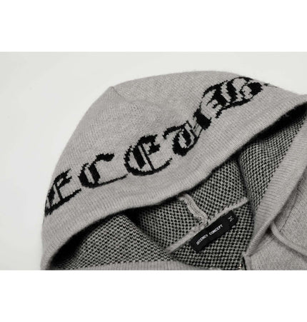Letter Jacquard Knit Hoodie – Loose Fit showcasing bold lettering on soft gray fabric with intricate knit details.