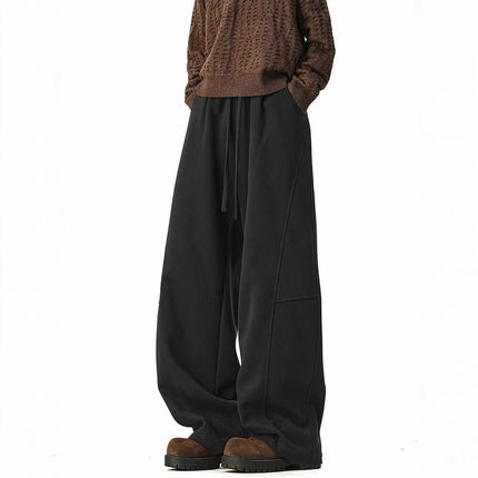 Heavyweight Wide-Leg Pants - Loose Fit displayed on a model in a casual outfit with a brown top and black pants.