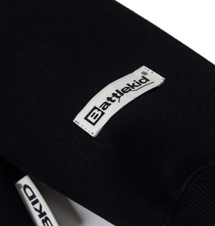 Cross Embroidered Hoodie – Loose Fit detail showing the Battlekid logo on the sleeve.